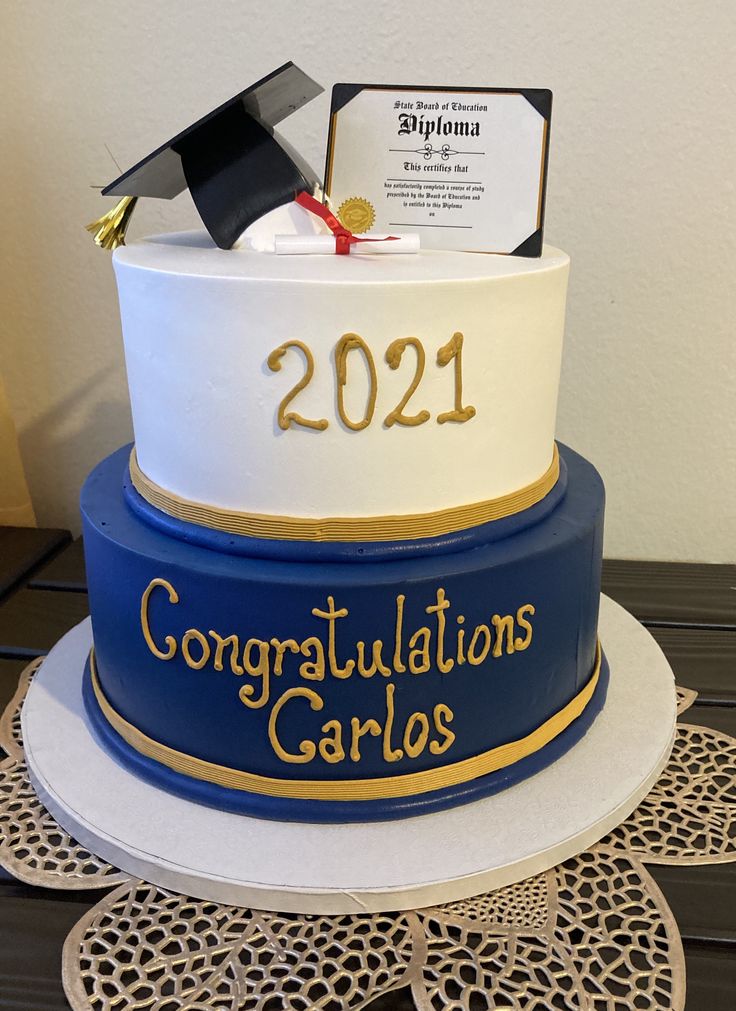 a graduation cake with congratulations cards on top