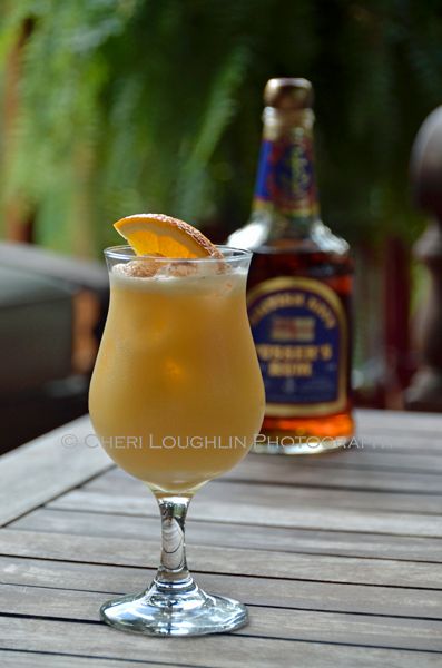 a drink sitting on top of a wooden table