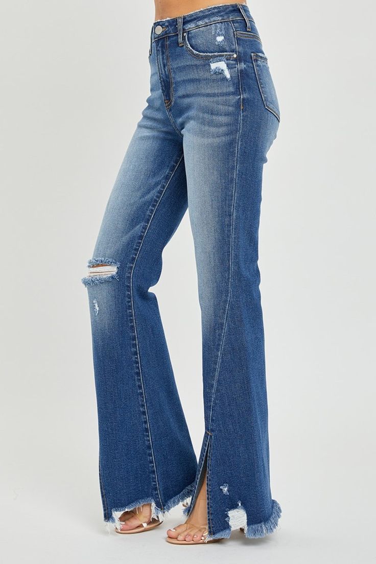 RISEN High Rise Front Slit Frayed Hem Flare Jeans These jeans make a statement! Designed with medium wash denim, these jeans feature a high rise, flare silhouette, distressing, and a unique slit hemline. Cute festival style! Medium wash High rise Flare silhouette Distressed Front slit Destroyed frayed hem Rise: 10.5” Inseam: 32.5” Fabric Content: 94.5% Cotton / 4% Polyester / 1.5% Spandex Fit: True to size Sizing: 1(25), 3(26), 5(27), 7(28), 9(29), 11(30), 13(31), 15(32) *Online Exclusive* Short Leggings, Romper Dress, Plus Size Tops, Jeans Pants, Tank Shirt, Flare Jeans, Tank Top Shirt, Jumpsuit Dress, Outfit Sets