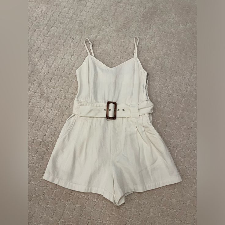 Never Worn Size Small Sleeveless Belted Jumpsuits And Rompers For Day Out, Chic Beige Cotton Jumpsuits And Rompers, Chic Beige Cotton Jumpsuit, White Belted Jumpsuits And Rompers For Summer, White Belted Jumpsuit For Summer, White Belted Jumpsuits And Rompers, Chic White Belted Jumpsuits And Rompers, Summer Beige Belted Jumpsuits And Rompers, Beige Belted Jumpsuits And Rompers For Summer