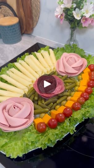 a platter filled with vegetables and meats