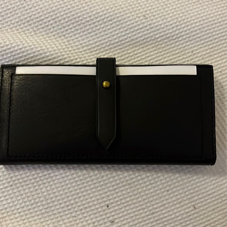 Brand New, Never Used Wallet With Protective Wrapping Black Bifold Wallet For Everyday Use, Classic Black Wallet For Everyday Use, Classic Black Wallets For Everyday, Black Leather Clutch With Snap Closure, Black Bifold Clutch With Card Slots, Classic Black Clutch With Card Slots, Classic Black Everyday Clutch, Black Bifold Clutch For Travel, Versatile Black Bifold Wallet