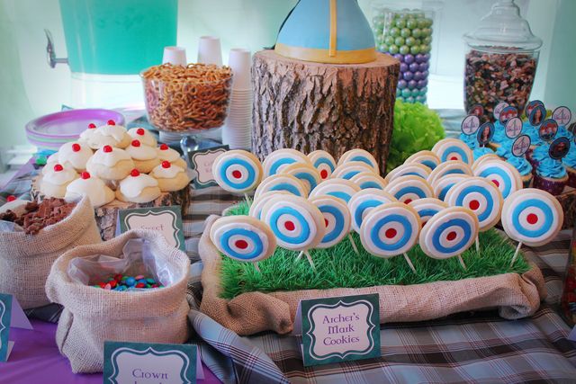 a table topped with lots of candy and treats