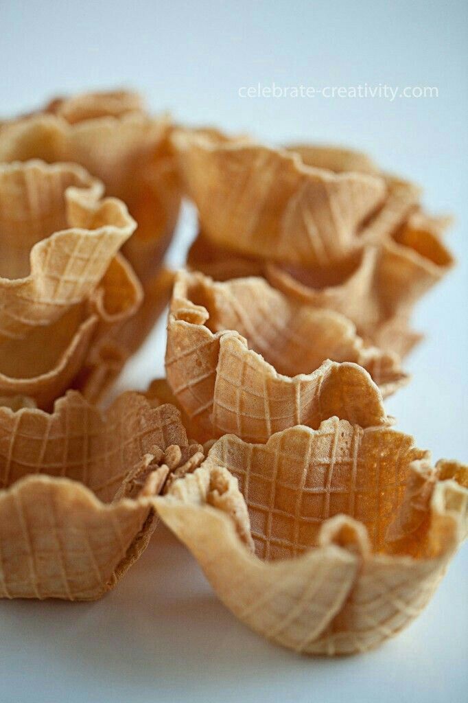 several peeled pieces of food on a white surface