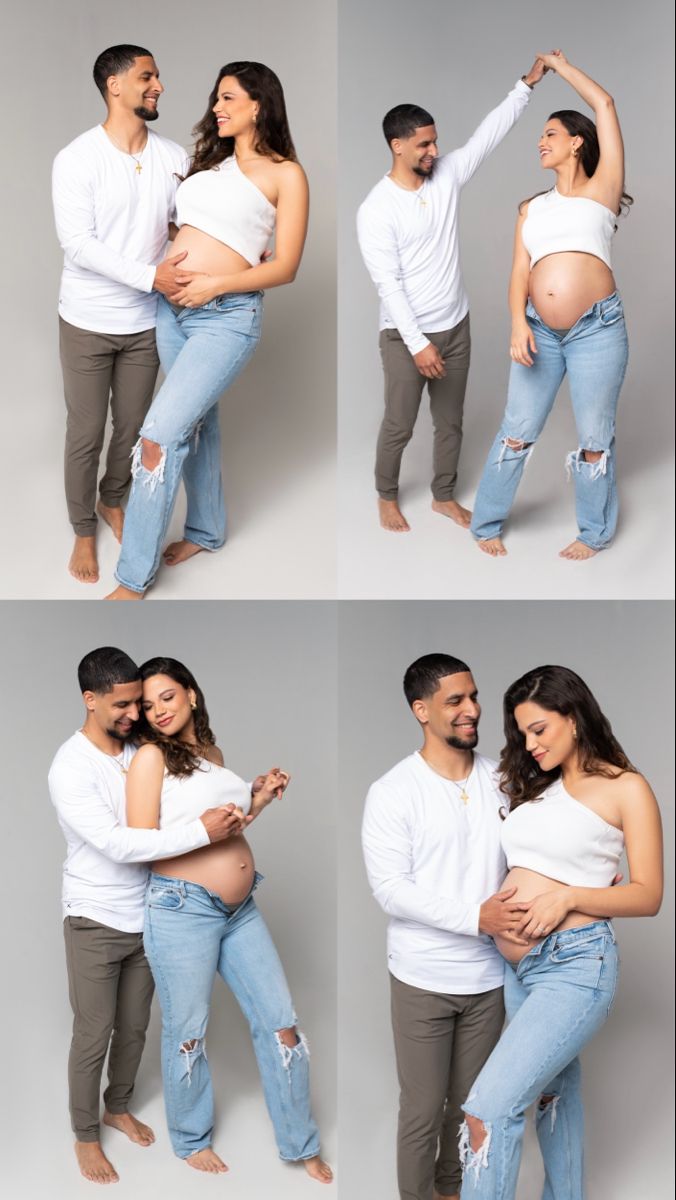 a man and woman are holding each other while posing for the camera with their pregnant belly