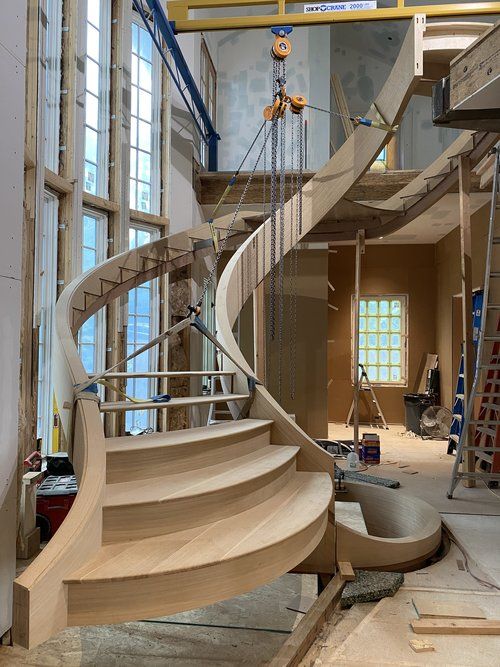 a spiral staircase being constructed in an unfinished building