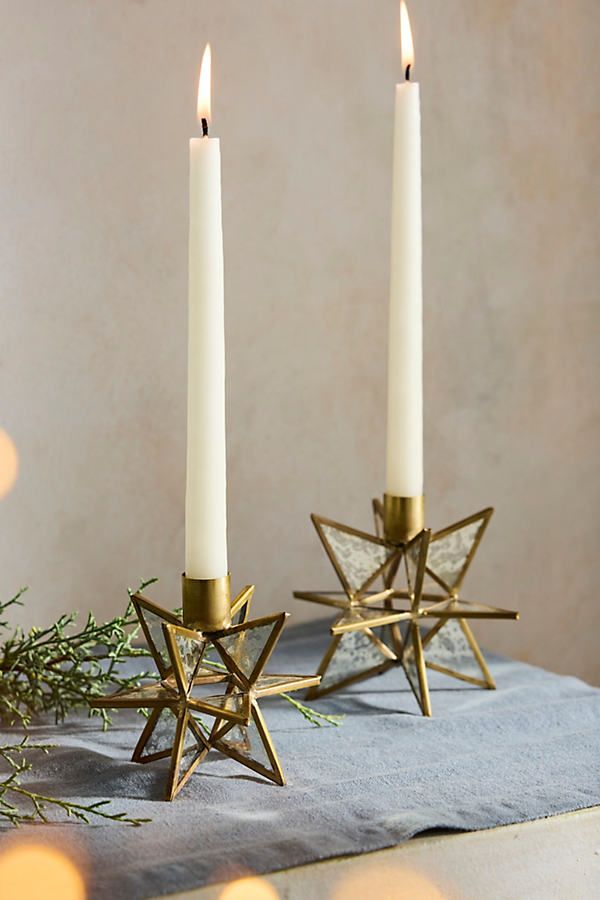 two candles are sitting next to each other on a table