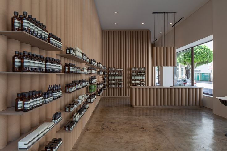 an empty store with shelves filled with bottles