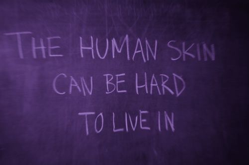 a blackboard with writing on it that says the human skin can be hard to live in