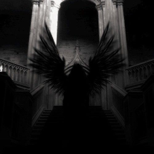 an angel is standing in front of some stairs