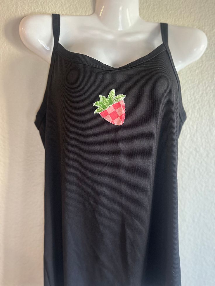 Hand sewn strawberry tank top. Patchwork top. Full length tank top. Ribbed and stretchy tank. Can be washed and dried on gentle settings. Message me for any customizations. If no customizations on specified patterns are listed, I will make the product as pictured. Cute Sleeveless Top With Strawberry Print, Cute Sleeveless Strawberry Print Top, Red Sleeveless Top With Strawberry Print, Sleeveless Red Top With Strawberry Print, Casual Sleeveless Top With Strawberry Print, Cute Stretch Cotton Tank Top, Cute Cotton Cami Tank Top, Cute Stretch Cami Tank Top, Fitted Cotton Top With Strawberry Print