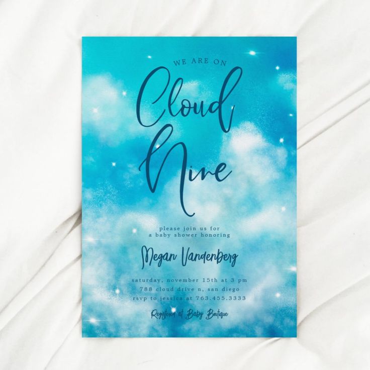 a blue and white wedding card with the words, we are on cloud nine written in cursive writing