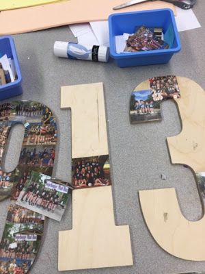 the letters are made out of wood and have pictures on them