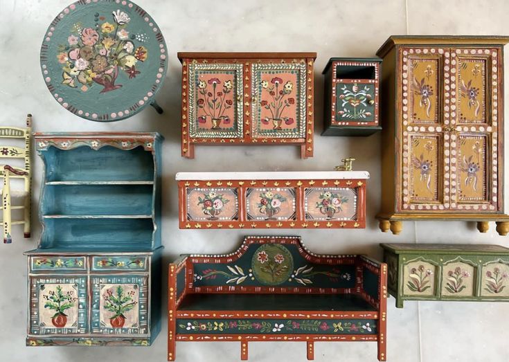 an assortment of painted furniture on display