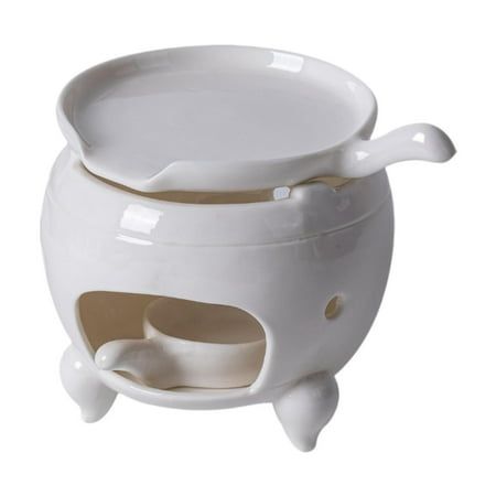 a white ceramic pot with a lid and handle