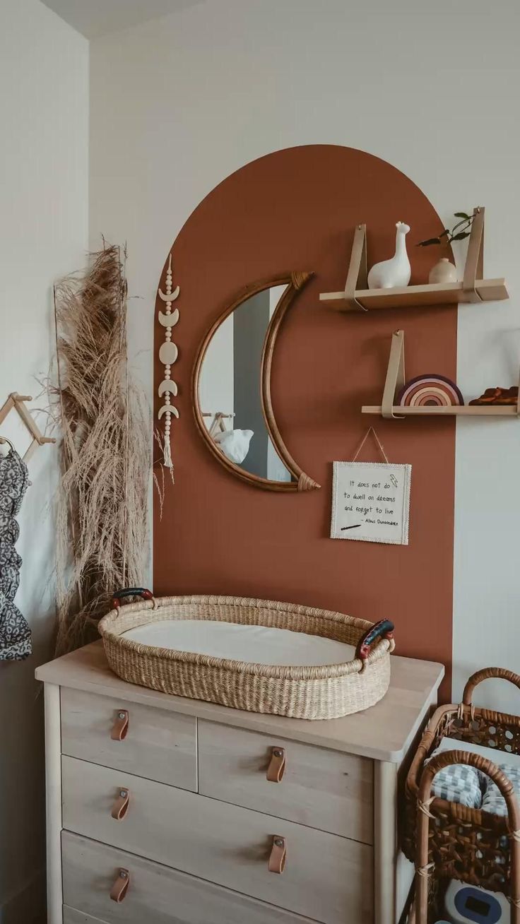 a baby's crib in the corner of a room with an orange wall