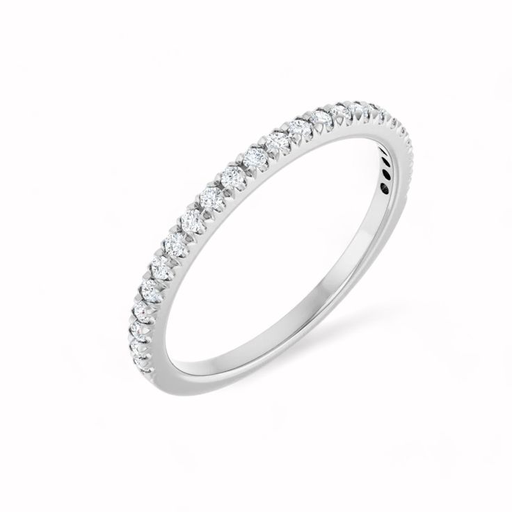 Elysium Black Diamond - RHEA RING Named after the goddess of motherhood and fertility, the Rhea Anniversary Band embodies nurturing elegance and timeless beauty. Crafted from luxurious 14k White Gold, this band features 23 lab-grown diamonds, each 1.3 mm in size, meticulously set to create a harmonious and radiant design. With a total carat weight of 1/4 CTW, the diamonds boast SI2-SI3 clarity and G-I color, offering a perfect blend of brilliance and sophistication. RING DETAILS:14k White Gold1/ Heirloom Style White Gold Stackable Rings, White Gold Rings With Lab Grown Diamonds, Classic Formal Stackable Rings With Halo Design, Classic Stackable Rings With Halo Design For Formal Occasions, Timeless Platinum Eternity Band, White Gold Eternity Band With Halo Design, Eternity Band With Halo Design As Gift, Timeless White Gold Bands With Brilliant Cut, White Gold Stackable Rings With Lab-grown Diamonds As Gift