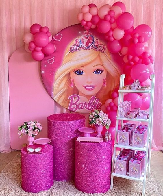 a barbie birthday party with balloons and decorations