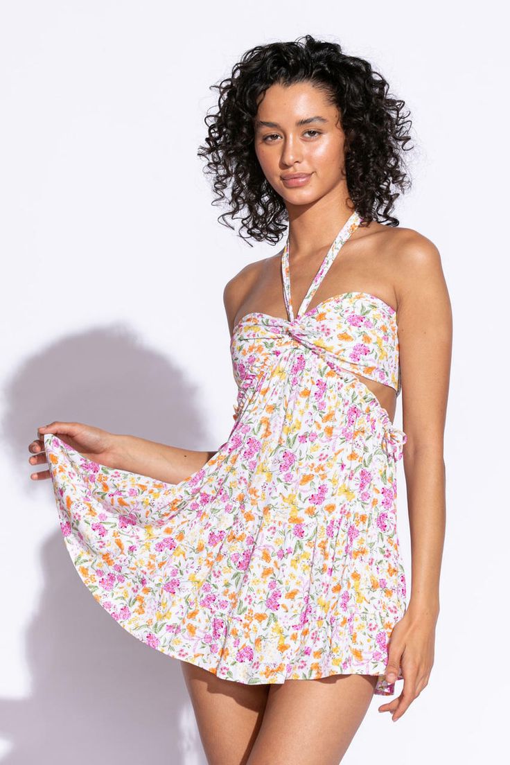 Floral Print Sundress Summer Flowy V-neck Halter Dress, Summer Mini Dress With Cutout For Beach, Summer Mini Dress With Cutout For The Beach, Summer Mini Dress With Cutout For Vacation, Spring Halter Mini Dress For Summer Parties, Spring V-neck Halter Dress With Crisscross Straps, Vacation Sundress With Cutout Details, Vacation Mini Sundress With Cutout, Brunch Halter Neck Dress With Tie Back