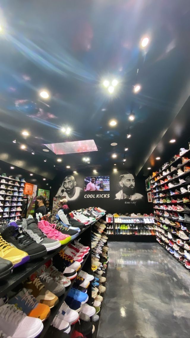 the inside of a shoe store filled with lots of shoes