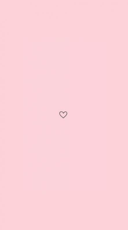 a pink wall with a heart drawn on it