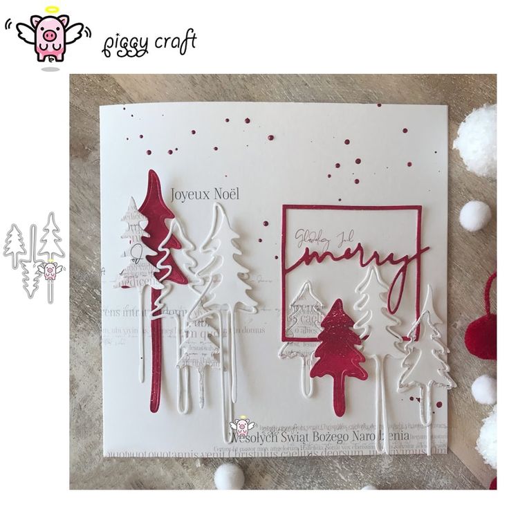 a card with some red and white trees on it