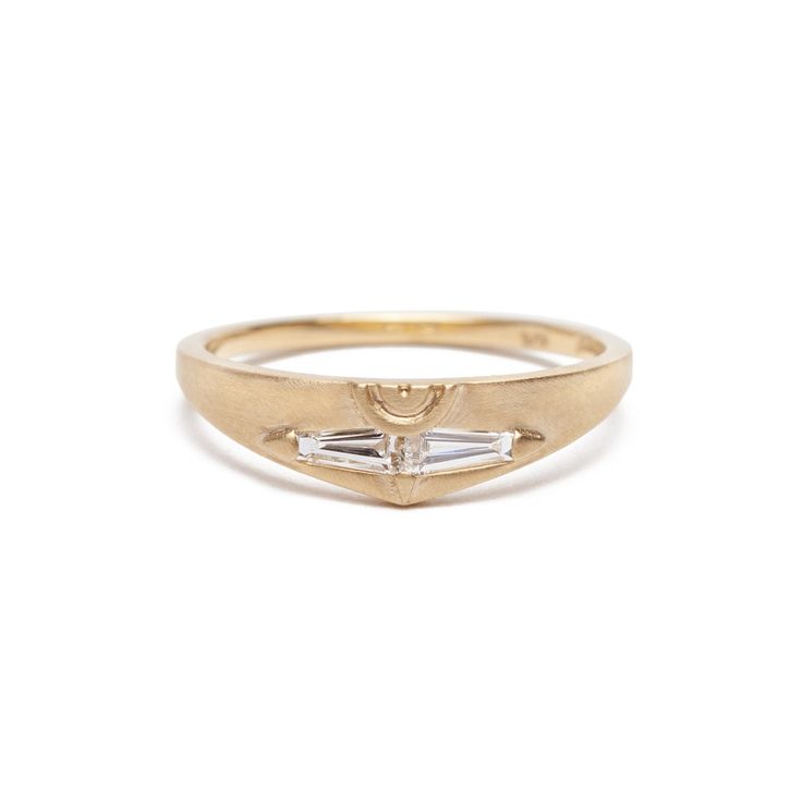 With its modern design and unusual details, the Spero diamond ring makes a great non-traditional engagement ring or diamond wedding band, or to mark a special occasion. Two sparkling tapered baguette diamonds are set in 14K yellow gold and connect to form a unique shape. Made to be matched, the Spero ring’s semicircle carving creates a full circle when paired with the Amandi Ring. Add to this set at once or at a later date by getting the Basio Ring which fits neatly next to the Spero's contoured Yellow Gold Rings With Si Clarity And Round Cut, Oval Diamond Ring With Si Clarity, Oval Diamond Rings Si Clarity, 14k Gold Rings With Si Clarity, Si Clarity Diamond Rings For Wedding, Timeless Diamond Ring With Si Clarity, Heirloom Baguette-cut Diamond Ring, Si Clarity Diamond Wedding Ring, Si Clarity Round Diamond Wedding Ring