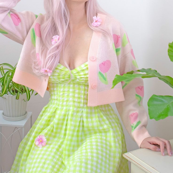 Step into whimsical Spring with our cropped fit jacquard cardigan, adorned with a charming tulip pattern in soft pastel pinks and greens! The comfortable fit ensures ease of wear, whether you're dressing up with a flowing dress or keeping it casual with your favorite jeans. Embrace the soft florals with this versatile piece that effortlessly adds a touch of enchantment to your look! 🌷💚 Details: ♡ 100% Acrylic ♡ Jacquard knit ♡ Model is 5'8" wearing a size Medium. *Please look at the size chart Tulip Outfit Ideas, Pastel Pink And Green Outfit, Pink And Green Aesthetic Outfits, Mums Aesthetic, Green Pink Outfit, Pink Pastel Outfit, Pink Green Outfit, Green And Pink Outfit, Pink And Green Outfit