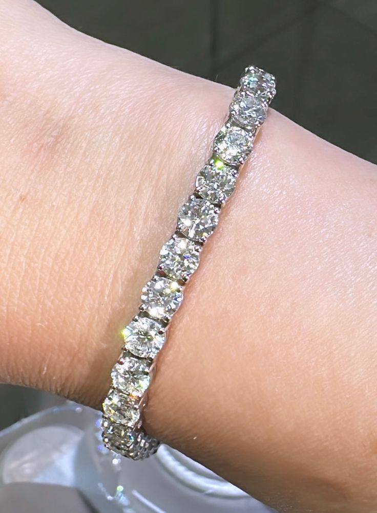 Make a sparkling statement with this 17.36ct tw classic diamond riviera line tennis bracelet. A unique design of round-cut diamonds is meticulously set in a beautiful white gold. Perfect for any occasion, this timeless piece will dazzle for generations to come! Metal: 14K White GoldDiamond Weight (33): Rounds 17.36ct t.w.Bracelet Length: 17.9cmLock: Box Catch With Hidden Safety Estimated production time is 4 - 5 weeks. Tennis Bracelet Diamond, Tennis Bracelet, Round Cut Diamond, Lab Diamonds, Timeless Pieces, Round Cut, Unique Design, Tennis, Unique Designs