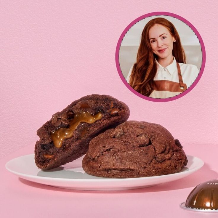 two chocolate cookies on a plate next to an image of a woman