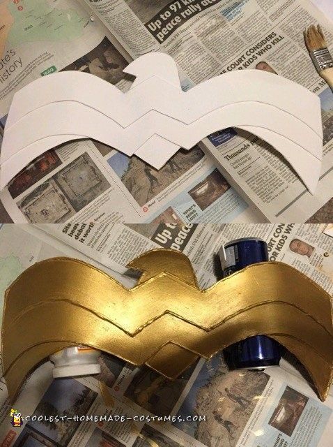 the paper is cut out to look like a batgirl's mask on top of newspaper pages