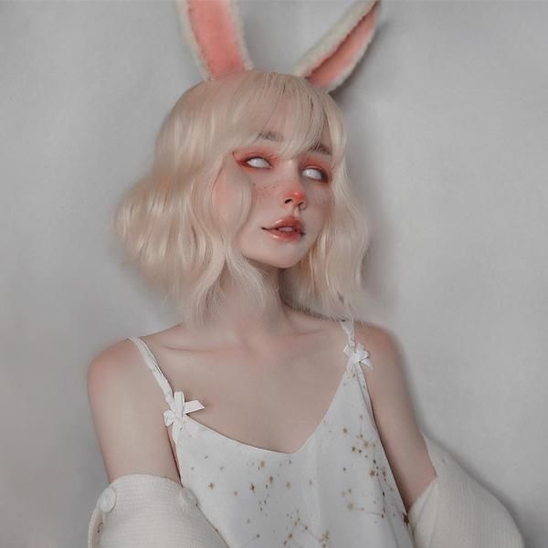 a woman with blonde hair wearing bunny ears