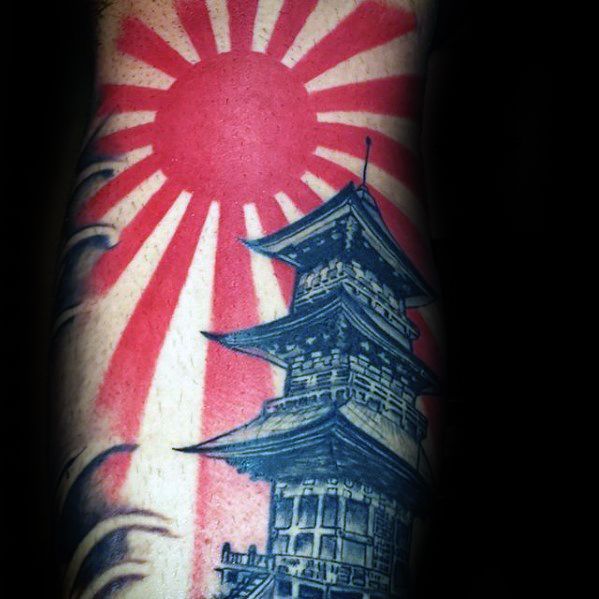 a man with a tattoo on his arm that has a japanese flag in the background