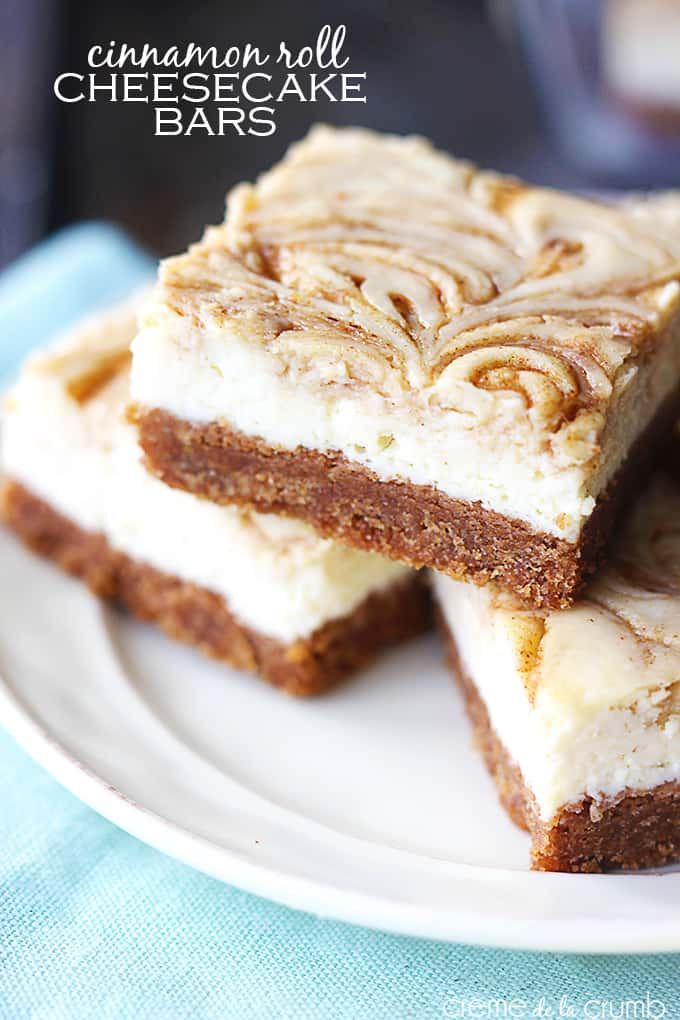 cinnamon roll cheesecake bars stacked on top of each other