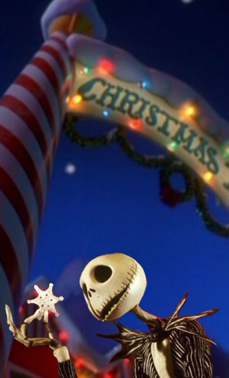 an animated skeleton holding a star in front of a christmas sign