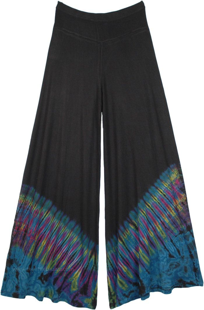 These loose and broad leg pants in black look very elegant and trendy, wide leg tie-dye palazzos feature easy pull-on styling and colorful accents. A very comfortable pair of pants in luxuriously soft fabric, these tie-dye palazzos are perfect - comfortable, bohemian and fun. #tlb #SplitSkirtsPants #vacationclothing #beachwrap #TieDye #Tiedyepalazzopants #widelegtiedyepantspants #festivalbohopants #wideleghippiepants Black Bohemian Wide Leg Pants, Tie Dye Stretch Wide Leg Bottoms, Black Wide-leg Rayon Pants, Black Flare Wide Leg Pants For Summer, Tie Dye Wide Leg Bottoms With Elastic Waistband, Tie Dye Wide-leg Pants, Pretty Pants, Dye Pants, Yoga Studio Design