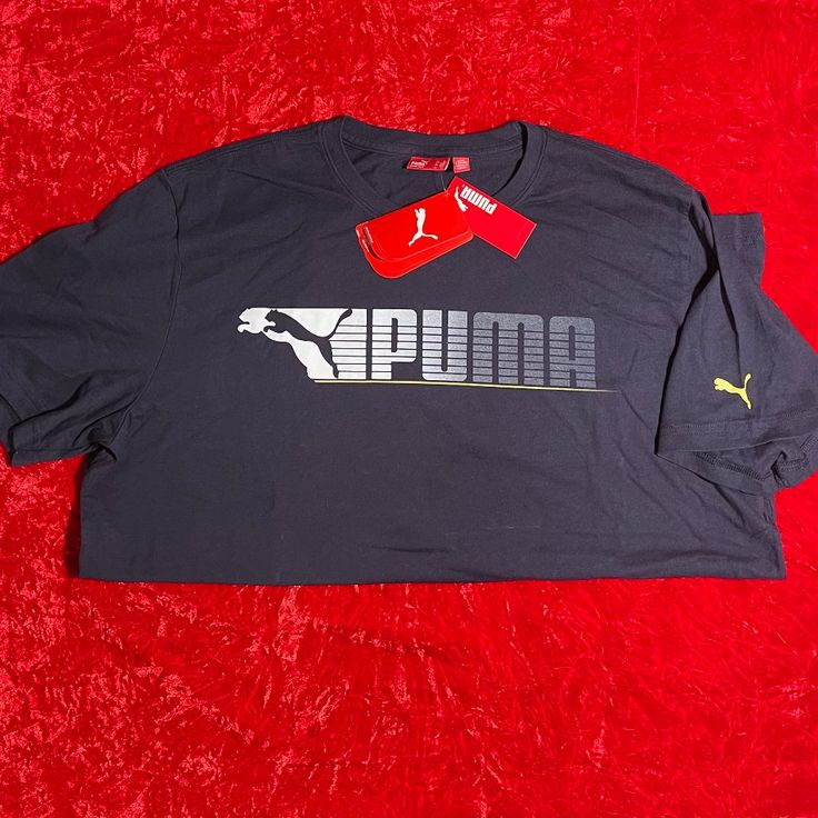 Puma Navy Graphic T-Shirt Ss - Xl | Condition: New With Tags. Casual Short Sleeve Top With Puma Logo, Short Sleeve Puma Tops For Streetwear, Puma Logo Graphic Tee With Crew Neck, Puma Graphic Tee With Crew Neck, Cotton Short Sleeve Tops With Puma Logo, Puma Graphic Tee With Short Sleeves, Casual Puma Logo Short Sleeve Top, Short Sleeve Cotton Top With Puma Logo, Puma Logo Graphic Tee For Sports