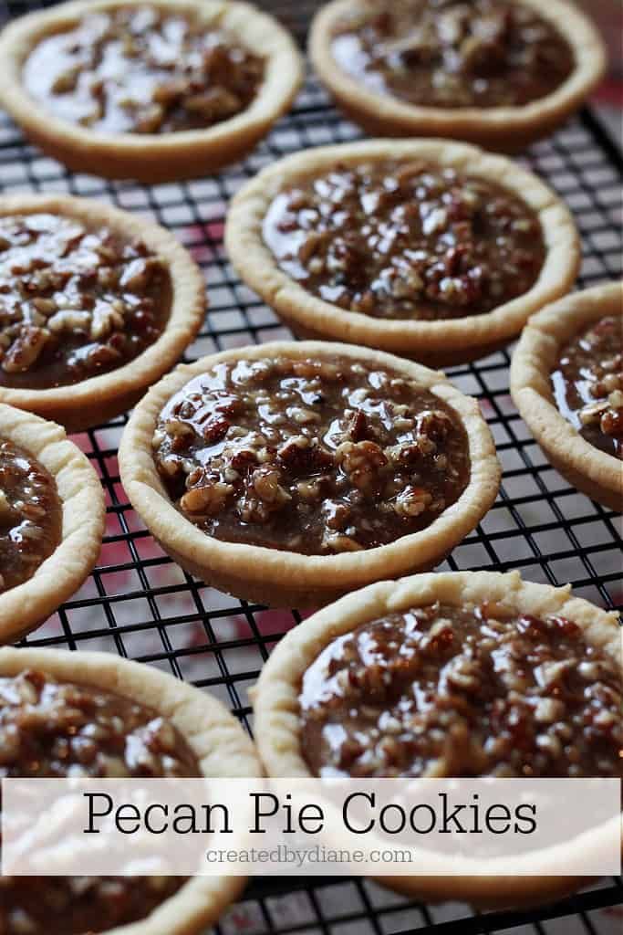 chocolate pecan pies cooling on a rack with text overlay that reads pecan pie cookies