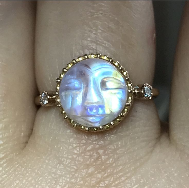 Please go to my Instagram to watch the video about this ring~ PRODUCT VIDEO ⇒ https://goo.gl/tkrFcq Like a little moon glowing In the sky. This stunning Man face rainbow moonstone dances with iridescence like you wouldn't believe. Such an elegant piece and with so much character. Perfect from day to night. Each piece of rainbow moonstone was hand carved, it's unique and charm. This listing is for one piece of rainbow moonstone ring only. Also available other stones, please see last photo. Gem: 1 Yellow Gold Moonstone Jewelry, Unique Yellow Gold Moonstone Jewelry, Unique Yellow Gold Moonstone Ring, Unique 14k Gold Moonstone Ring Gift, Gold Round Mystical Moonstone Ring, Celestial Yellow Gold Moonstone Ring, Yellow Gold Moonstone Jewelry With Halo, Yellow Gold Moonstone Jewelry With Halo Detail, Yellow Gold Halo Moonstone Jewelry