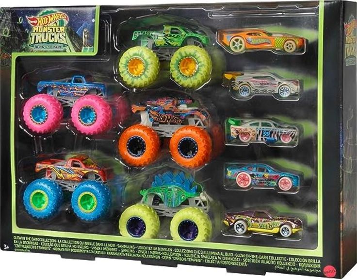 the monster trucks are all different colors and sizes in this toy set, which includes four large tires