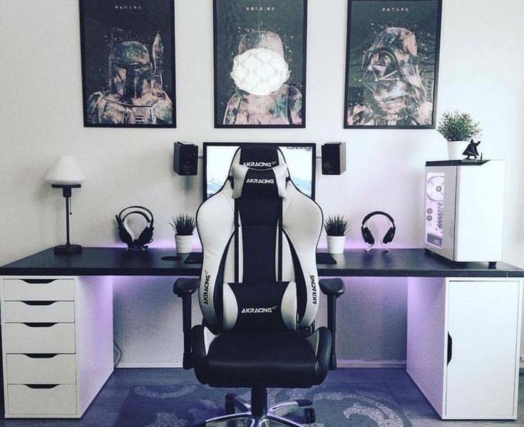 a chair sitting on top of a blue carpeted floor next to a computer desk