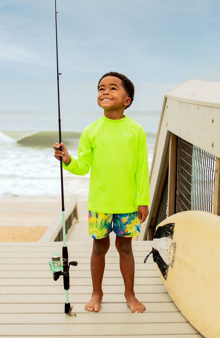 Your little one will shine bright this summer in this lime green UPF 50+ long sleeve sun shirt. Proudly made in the USA! Spring Long Sleeve Rash Guard With Uv Protection, Long Sleeve Rash Guard With Upf 50+ For Spring, Playful Long Sleeve Rash Guard Upf 50+, Casual Uv Protection Rash Guard For Spring, Playful Long Sleeve Rash Guard With Uv Protection, Casual Rash Guard With Uv Protection For Spring, Casual Spring Rash Guard With Uv Protection, Casual Summer Crew Neck Rash Guard, Playful Long Sleeve Rash Guard For Beach