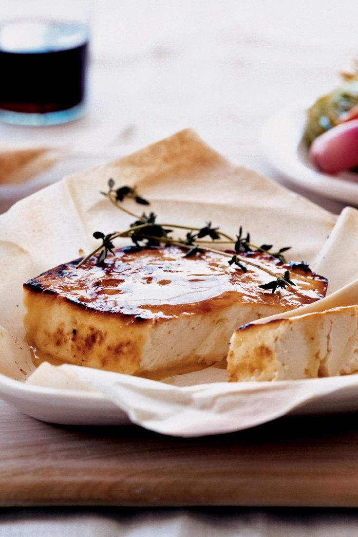 some food is sitting on a plate and ready to be eaten with other dishes in the background