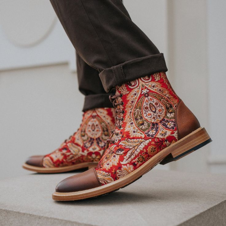 Thanks to our signature fabrics, the Jack in Red Paisley men's boot from TAFT will instantly add a bold finish to your look. The full-grain calfskin takes them to another level. Jacquard woven upper with leather lining TOE & HEEL CAP: Italian full-grain calfskin OUTSOLE: Leather sole with rubber inserts Standard D Width Blake Construction (resoleable) Our boots and shoes that are leather soled can stain and bleed. We do not recommend wearing in wet conditions. Staining may bleed and could stain Taft Boots, Taft Shoes, Cap Toe Boots, Leather Sole Shoes, Timberland Style, Red Paisley, The Jack, Heel Caps, Hot Shoes