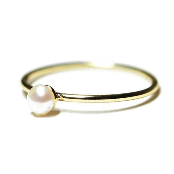 apop Exclusive, mini pearl ring, elegant and chic silver mini pearl ring. Made of .925 sterling silver. Smooth polished finish band. Features beautiful seed pearl at center. Can be worn alone or paired with complementing mini pearl earrings. Ideal for: Daytime wear, Date Night, Office Measurements: pearl: 3mm; 1mm band width Material: Cultured Pearl, 925 Sterling Silver, Rose/Goldtone Finish Elegant Adjustable Tiny Pearl Ring, Elegant Everyday Pearl Ring With Simple Design, Simple Pearl Ring As A Gift, Minimalist Round Pearl Ring With Pearl Drop, Everyday Pearl Ring With Charm, Tiny Everyday Pearl Ring, Elegant Everyday Pearl Ring With Round Band, Dainty Tiny Pearl Ring For Everyday, Simple Pearl Ring For Wedding