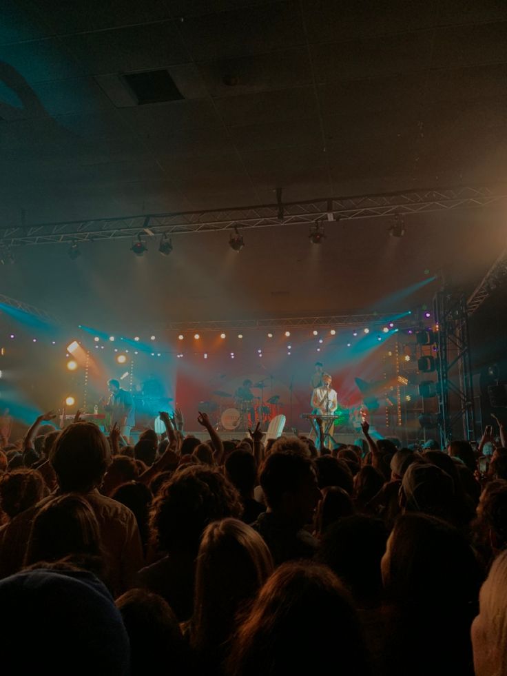 a group of people standing on top of a stage