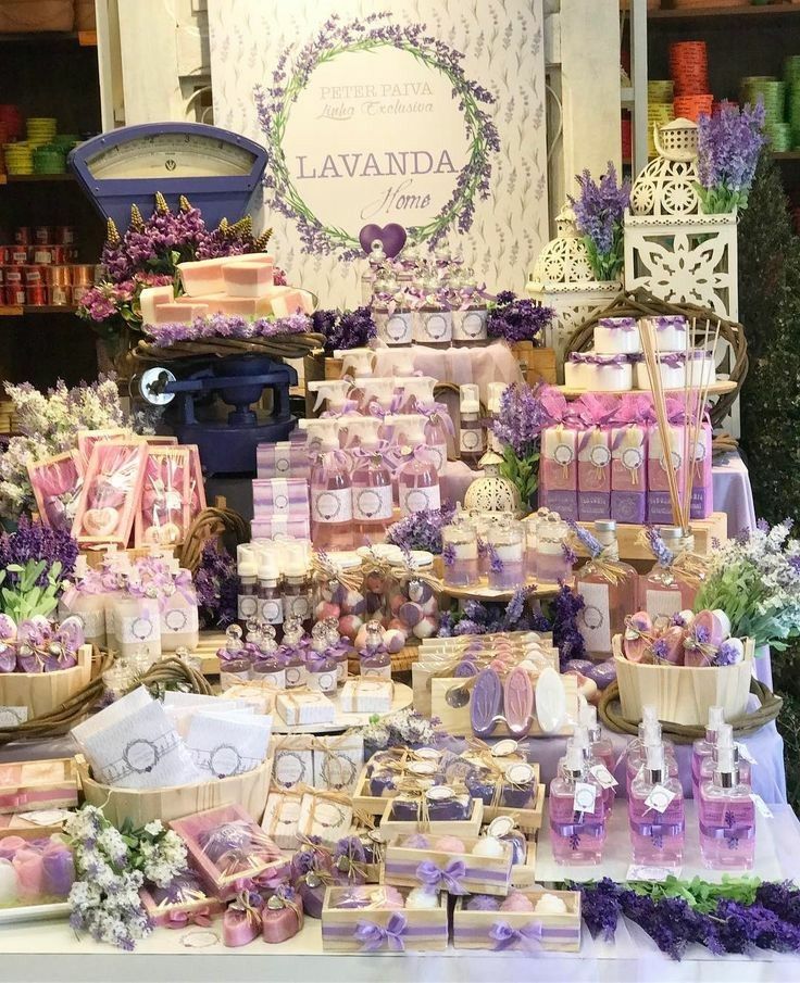 a table topped with lots of purple and white items