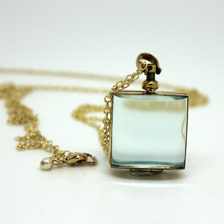 Brass and silver locket chains are available in labradorite, freshwater pearls,14kt gold-filled, and sterling silver. The glass is encased in brass or sterling silver. The round pendant is 25 mm in diameter; the square pendant is 23 mm across Available in lengths 26 and 34 inches (Note: the labradorite and pearl chains do not have a clasp, they slip right over the head - if you would like one just let me know and I'll put one on at no extra cost) Starting at $123.99 The glass locket necklace has Elegant Glass Jewelry For Keepsakes, Vintage Clear Glass Necklaces, Vintage Glass Necklace Nickel Free, Vintage Glass Nickel-free Necklace, Vintage Nickel-free Glass Necklace, Vintage Clear Glass Necklace, Vintage Clear Pendant Necklace, Vintage Clear Necklace For Gift, Glass Keepsake Jewelry In Clear