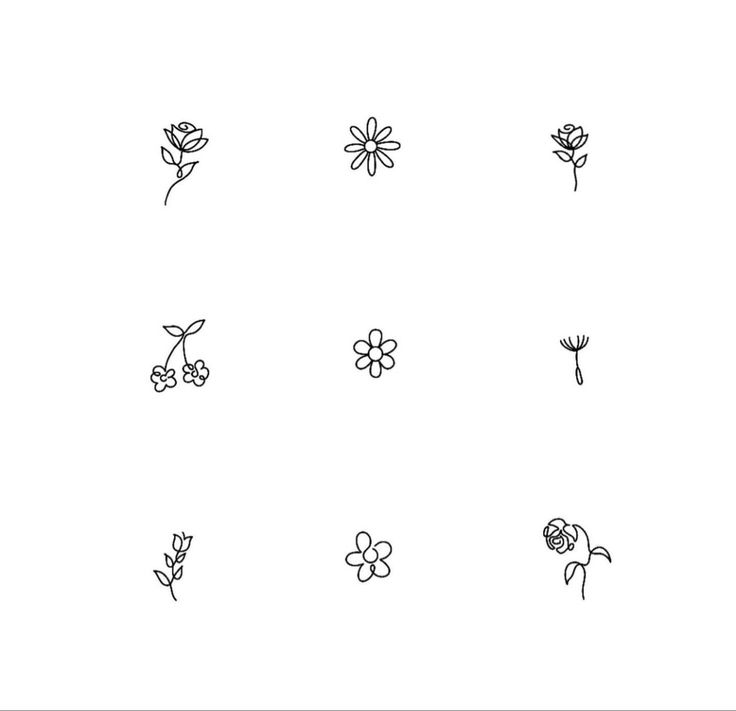 a bunch of flowers that are drawn on a whiteboard with black marker pens and ink