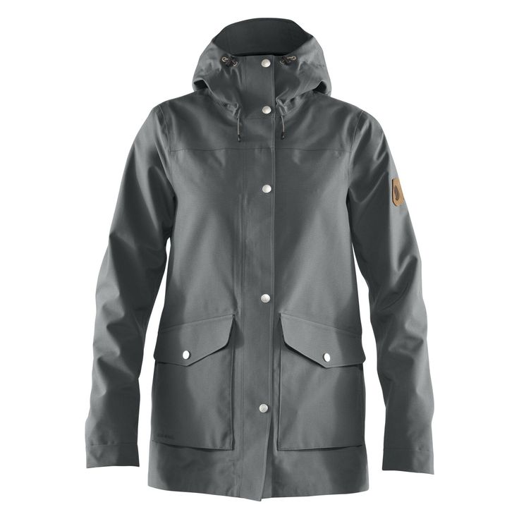 Fjallraven Greenland Eco-Shell Women's Jacket Description A 1970s classic that has warmed generations of nature lovers – now with an improved fit and sustainable materials. Weather-resistant outer fabric, soft teddy-fleece lining and practical details make for a winter jacket that is equally at home in the forest as in town. Its water resistant properties can be enhanced with Greenland Wax, which further increases the durability of an already long-lasting jacket. Features Durable in wind- and wa Fjallraven Women, Skate Fits, Wet Weather, Shell Jacket, Womens Clogs, Padded Jacket, Waterproof Fabric, Office Outfits, Outdoor Outfit